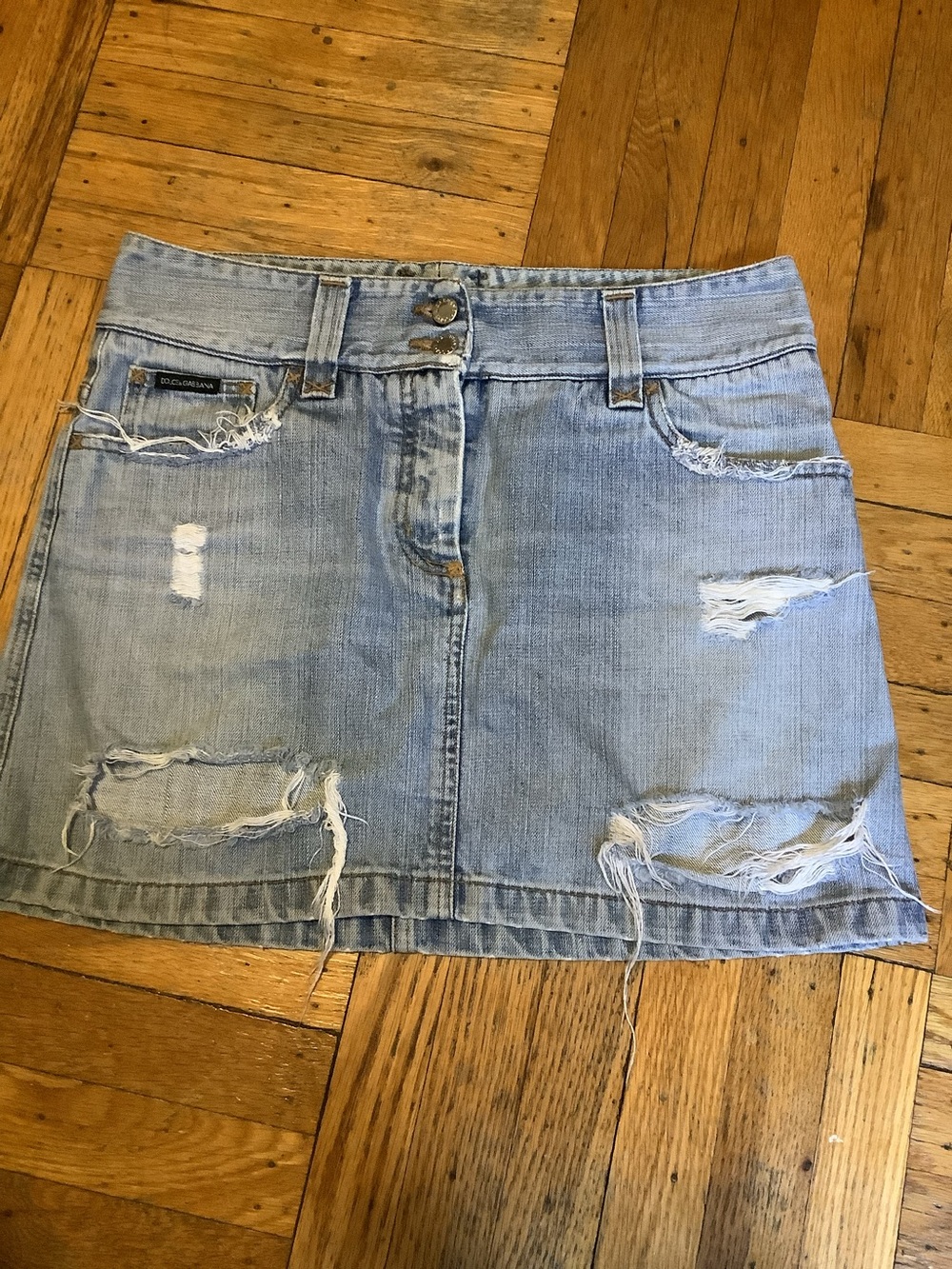 Dolce and Gabbana Distressed Denim Skirt.